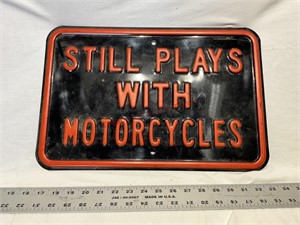 Still Plays With Motorcycles metal sign