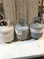 1 full and 2 empty propane tanks