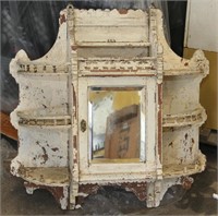 Very ornate wall cabinet with three half round