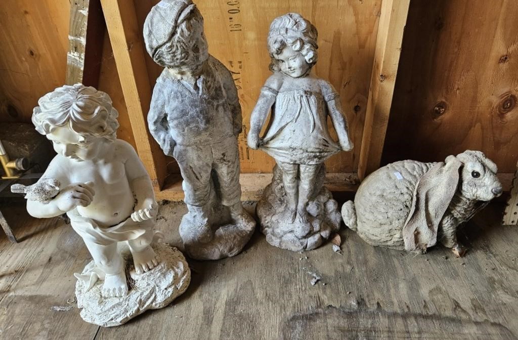 Yard figurines. 3 are stone and 1 plastic. 4