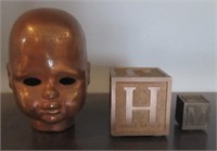 Brass decorative baby head and solid brass letter