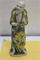 A Chinese Famille Juane Fisherman Figure