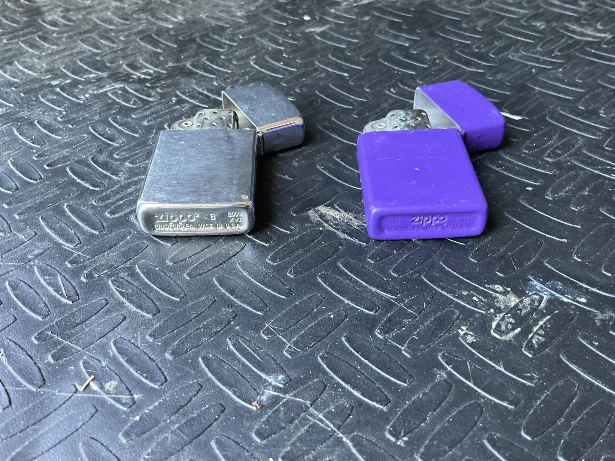 Slightly smaller silver and purple zippo lighters