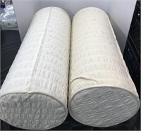 Cylinder shaped off white pillows