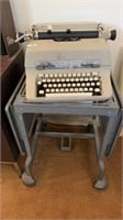 Manual typewriter with stand