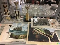 Assorted vintage prints and trophies.