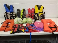 11 Life Jackets; infant to adult sizes, in tote