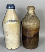 2 stoneware beverage bottles, impressed P.C.