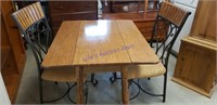 Drop leaf table with 2 iron chairs 30 inches tall