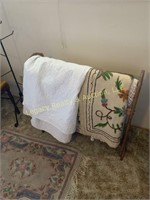 oak quilt rack w/ quilts and blankets