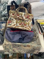 lot of purses and bags, one carpet bag