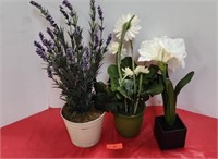 Artificial flowers in plastic pots.