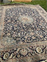 9’ 11” x 12’ 10” area rug
Knotted in Iran