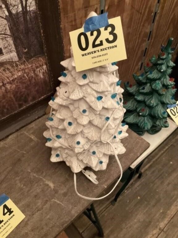 White ceramic Christmas tree missing some bulbs