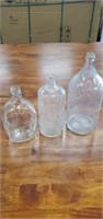 3 assorted vintage glass bottles
