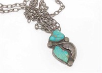 Silver and turquoise pendant on silver chain