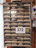 Plastic organizer with drawers (48) and contents