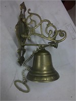 brass bell and holder