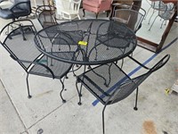 WROUGHT IRON TABLE AND (4) CHAIRS