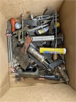 Box of tools, files, grease gun, and more
