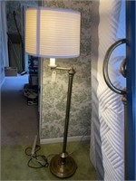 Brass or brass style extending arm floor lamp.