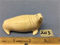 3" x 1 1/4" antique carving of a walrus, inset bal