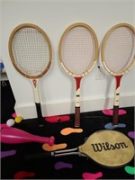 Tennis rackets & wiffle ball. Basement toys.