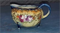 Antique three-footed fine porcelain creamer