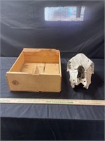 Fruit crate and cow skull