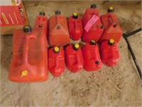 12 plastic gas cans w/ air openings 1 - 5 gal