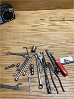 Miscellaneous wrenches, pliers, and a chisel