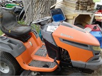 Husqvarna riding lawn mower. Runs and drives.