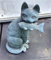 Outdoor Garden Cat with a Fish in His Mouth