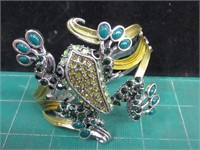 Large jeweled frog clamper bracelet.