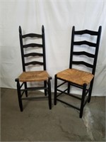 Two wood chairs with wicker seats 19 inches from