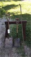 Antique wood handled shovels and pry bar