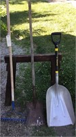 Assorted hand tools, shovels, rake