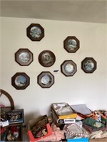 Hanging wall plates with birds and a house