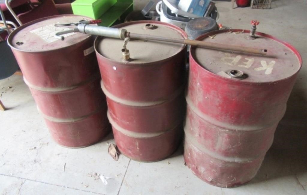 (3) 55 Gallon metal barrels. (1) Is partial full,