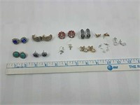 11 sets of earrings containing rhinestones