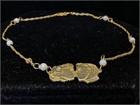 14K Gold Bracelet with people design 
4.5 inches