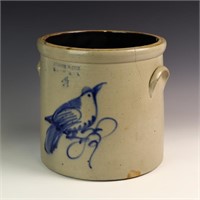 Bird decorated crock, has cracks