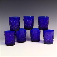 Seven cobalt blue glasses