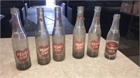 Red rock and 5 Heart club bottles