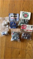 Six bags of Collector marbles, different color
