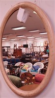 Oval wall mirror with painted frame decorated