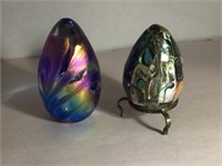 TWO EGG PAPERWEIGHTS. ONE IS GLASS w AN AURORA BOR