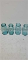 4  blue glass jars