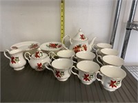 27 pc. Holiday plates, cups, pitcher, sugar creamr