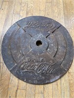 Coca Cola cast iron base. 22” across.